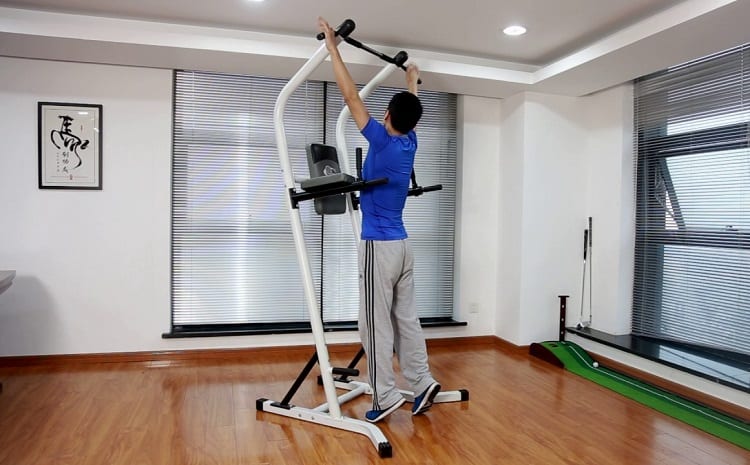 Man Doing Pull Ups On Power Tower